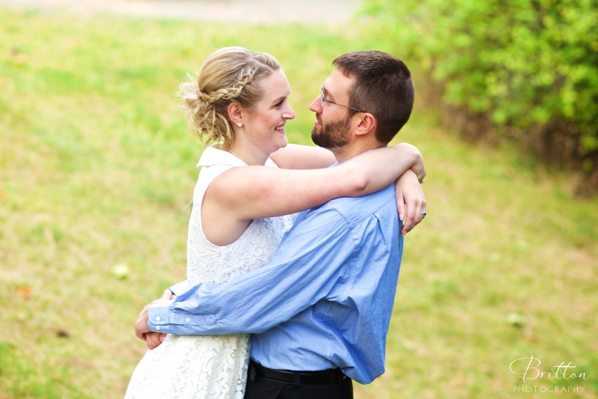 Engagement photo at Manito Park of a couple embracing