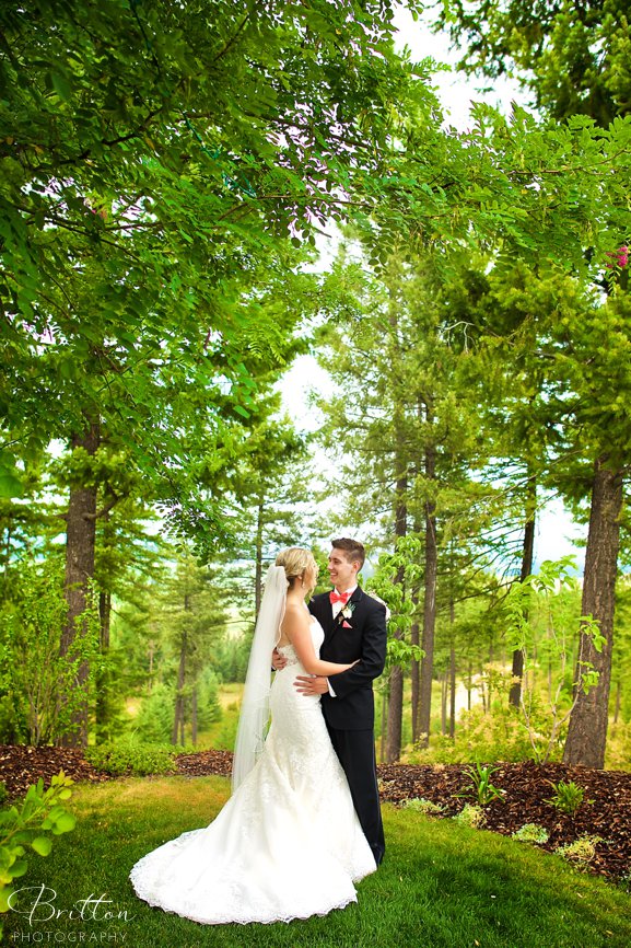 Photo of a bride and groom in a forest clearing at Rocking K Ranch